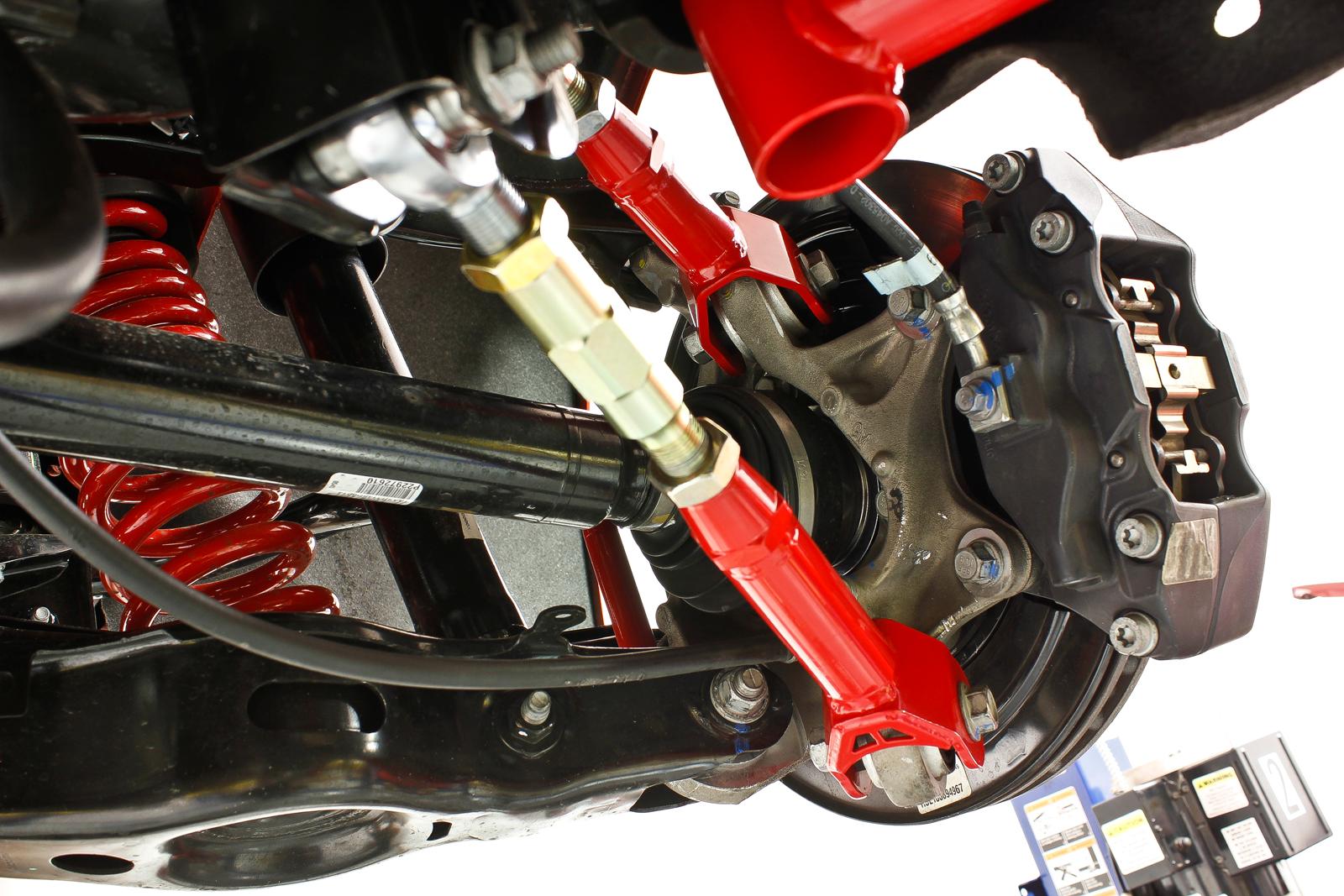 Lower trailing arms, on-car adjustable, rod ends